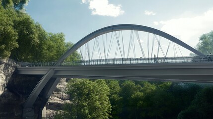 Obraz premium A curved steel structure bridge, its deck suspended elegantly by two main arches, creating a perfect blend of function and modern design. 