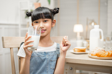 woman drinking orange juice