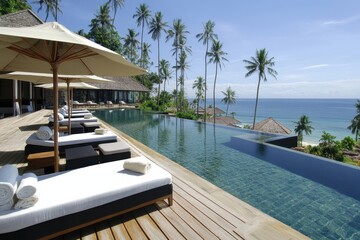 Fototapeta premium Luxury Resort Poolside Relaxation with Ocean View in Tropical Paradise, Elevated Angle, Koh Samui Thailand