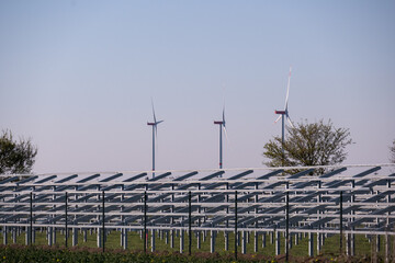 Device for solar system in the background wind turbines