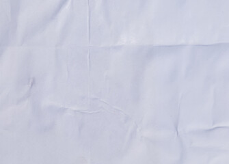 Distressed white paper with layered wrinkles and glue remnants, perfect for a vintage backdrop.