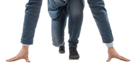 Determined young businessman kneeling at a start line isolated on transparent background. Business challenge and motivation concept