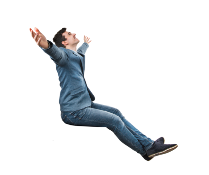 Excited young businessman seated with arms wide opened, looking up imagining himself in other place. Male isolated on transparent background dreaming of vacation