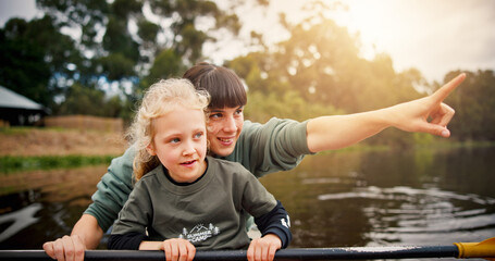 Lake, child and woman with pointing for kayak, water activity and adventure in summer camp. River, female instructor and girl with learning for canoeing, skills development and paddle outdoor in boat