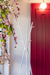 a white coat rack in an institution, an element of the interior
