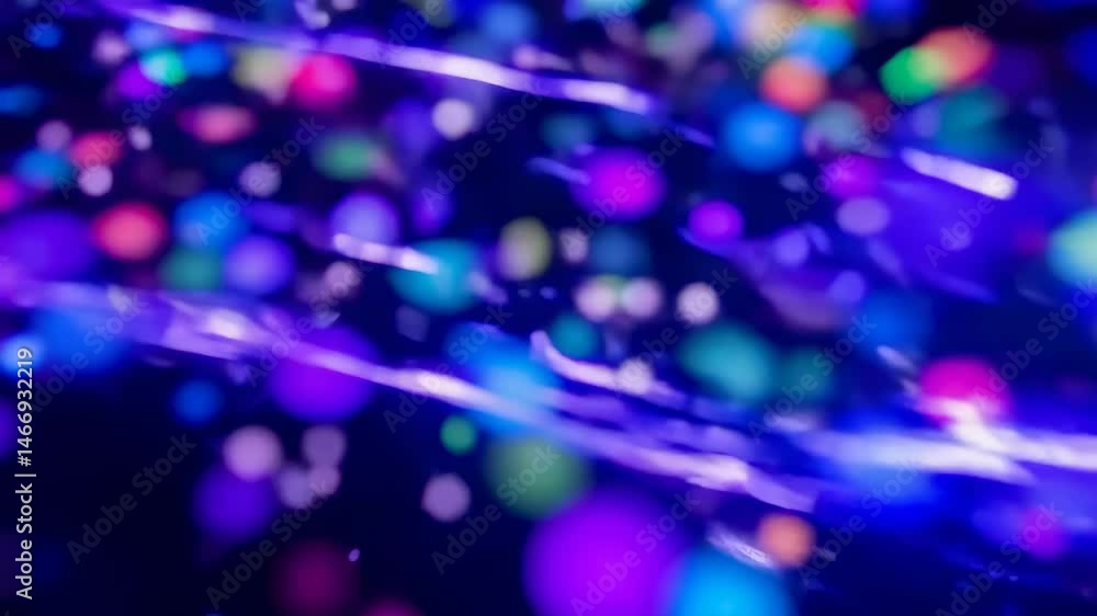 Poster bright colorful circles floating on a deep blue background with strands of light flowing through the