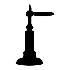 Silhouette of antique tshaped tap or spigot standing on a ornate base