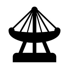 Silhouette of a swing ride at an amusement park in black