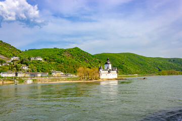 Pfalzgrafenstein Castle on the Rhine near Kaub (Germany), surrounded by green hills and river landscape