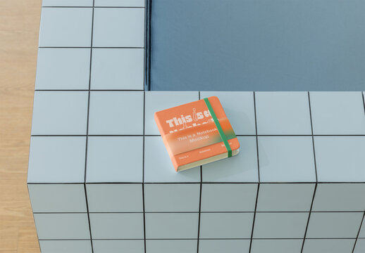 Notebook Mockup Placed on a Tiled Table Top