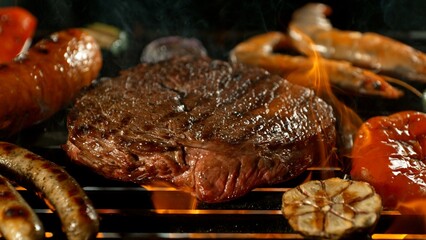 Close-up of Beef Steak on a Grill with Roaring Flames