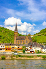 St. Bonifatius Church and Clemenskapelle in Lorch (Germany) above the Rhine river on a sunny day