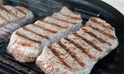 Grilled Steaks on a Scorching Hot Grill  Perfectly Cooked and Appetizing Meat Delight