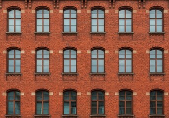 Obraz premium Red Brick Building Exterior Facade Architectural Windows Design Old Wall City Urban Retro Brown