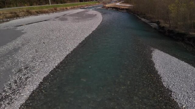 Linth river shallow water around pebble stones Switzerland Swiss alpine stream