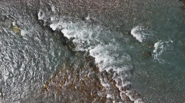 Linth river Switzerland aerial drone over water flow texture cold mountain nature