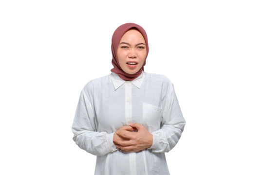 Unhealthy young Asian Muslim woman touching belly, having stomach pain isolated on transparent background
