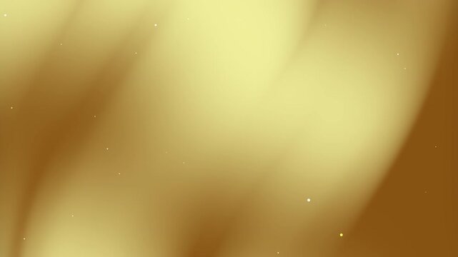 Abstract gold gradient creates a blurry gold background with specks of light. Suitable for luxurythemed designs and elegant branding projects