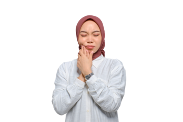 Young Asian Muslim woman feeling pain, holding her cheek with hand, suffering from severe toothache isolated on transparent background