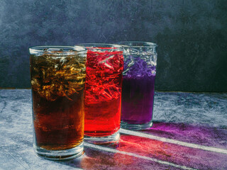 A lot of Soft drinks in colorful and flavorful glasses on the table,Glasses with sweet drinks with...