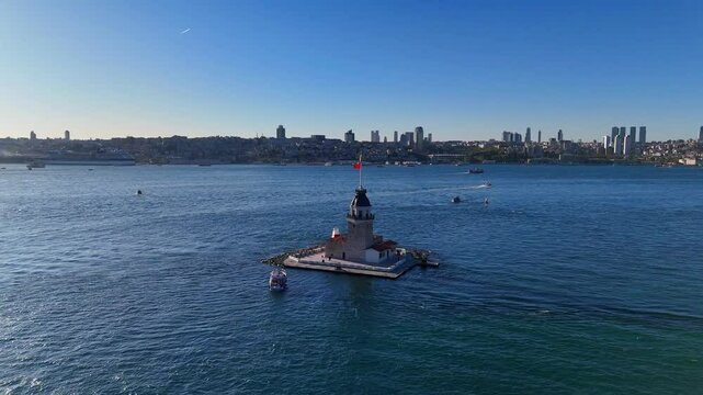 Aerial View of the Maiden's Tower (Kiz Kulesi) in Istanbul, Turkey.A stunning aerial shot of the Leander's Tower in ultra hd 4k video, situated in the shimmering blue waters of the Bosphorus, Uskudar