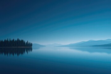 Fototapeta premium clear blue sky overlooks tranquil lake in national park with trees lining horizon in this minimalistic scene