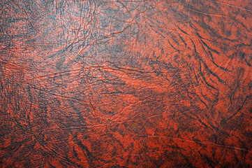 Dark orange,brown color leather skin natural with design lines pattern or red abstract background.