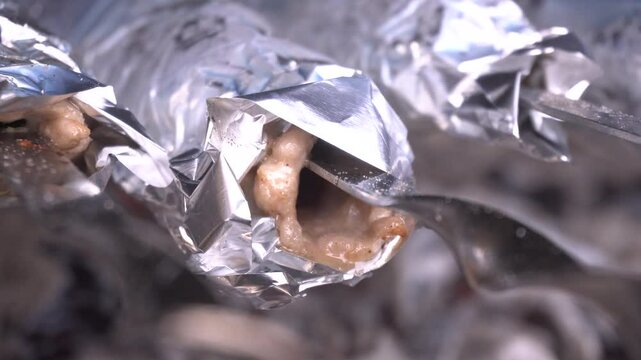 lula kebabs grilling on metal skewers, rotating for uniform browning over high heat, releasing savory aromas