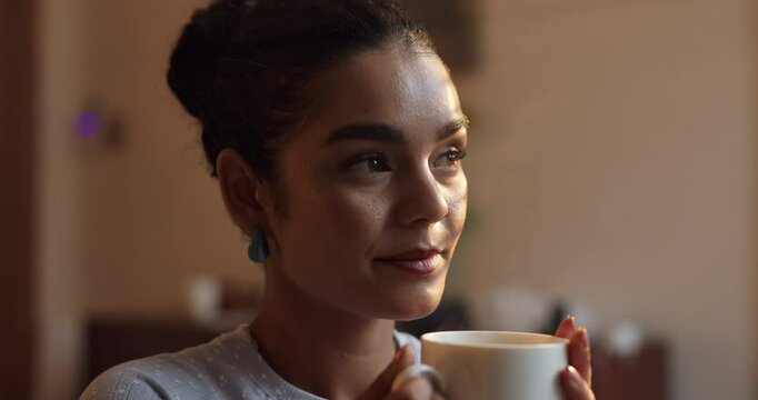 Thinking, morning and girl with coffee in home for caffeine break, resting and warm beverage. Thoughtful, relax and person with latte, tea and espresso for calm, peace and inspiration in living room