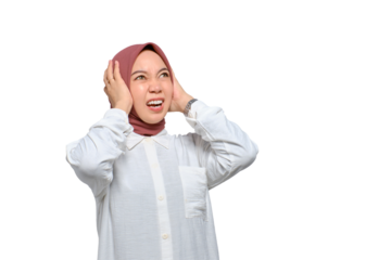Angry young Asian Muslim woman screaming covering ears with both hands, distressed by noise isolated on transparent background