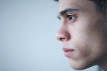 portrait of molder face positioned strictly on left side showcasing strong emotion