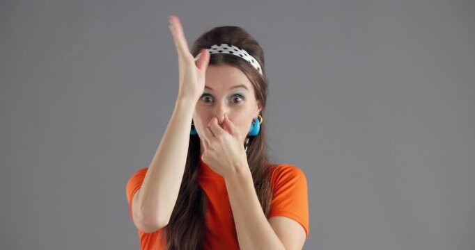Woman, dancing and face in studio with vintage style, smile and excited for disco by background. Girl, person and laughing in portrait with peace sign, fashion and retro event with costume in USA