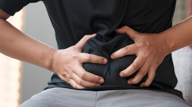 Man has stomach ache from food poisoning