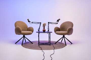 Podcast setup with two chairs and microphones ready for an educational interview