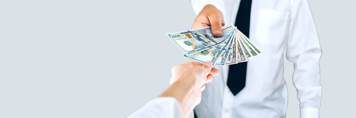 Banner, Transfer of money from hand to hand American dollars. On a white background.