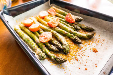 asparagus with tomatoes and cheese. diet. food concept
