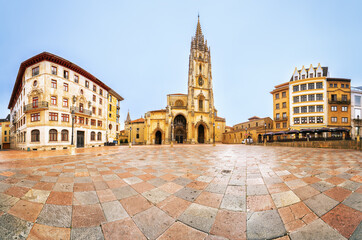 Fototapeta premium Wide-angle view of the Cathedral of San Salvador in Oviedo, Spain, located in the historic Plaza Alfonso II; the Gothic architecture of the cathedral . 