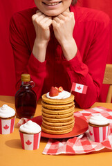 Canada Day traditional food concept. A girl in a classy cafe eats in Canada. Breakfast and lunch.