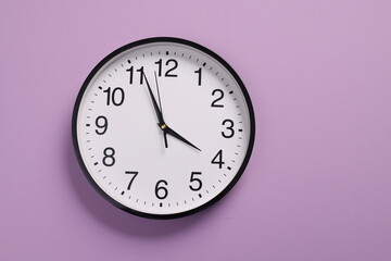 Close-up of a wall clock. The concept of time and work time is valuable for life, Alarm clock...
