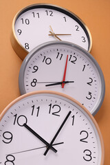 Close-up of a wall clock. The concept of time and work time is valuable for life, Alarm clock stopped. photo in a coloured background