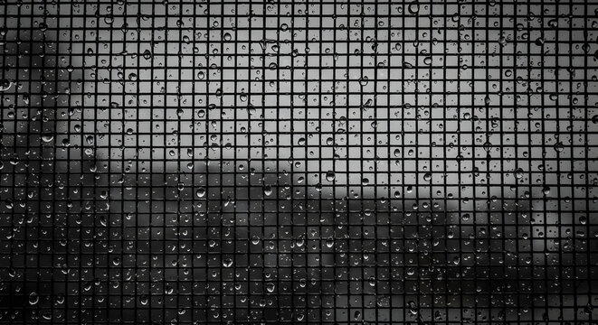 Raindrops On Window Screen Creates An Abstract Rainy Day Atmosphere