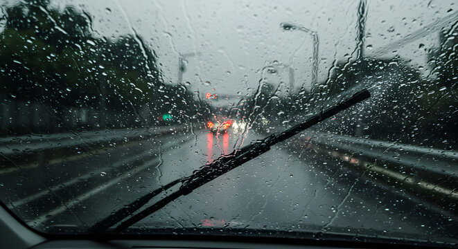 Driving Through The Rain Splattered Windshield On A Gloomy Day