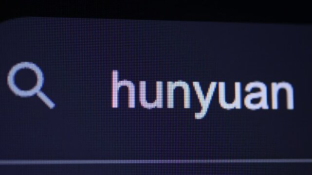 A dark digital screen showing a close-up of a search bar with the term "hunyuan" typed in, adjacent to a magnifying glass icon.