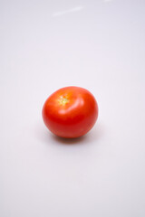 red tomatoes on a white background