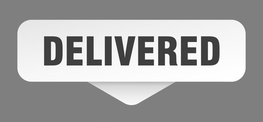 delivered sticker. delivered sign isolated on gray background
