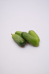 green cucumbers on a white background