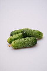 green cucumbers on a white background