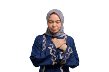 Portrait of young Asian Muslim woman pressing hand to chest, having heart attack isolated on transparent background