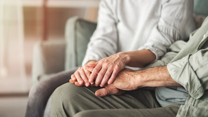 Comforting hand supporting the old man