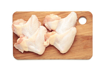 Raw chicken wings on cutting board isolated on white background.